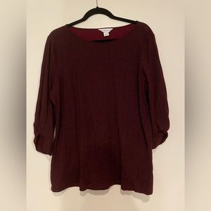 Dark red blouse with black pattern detail